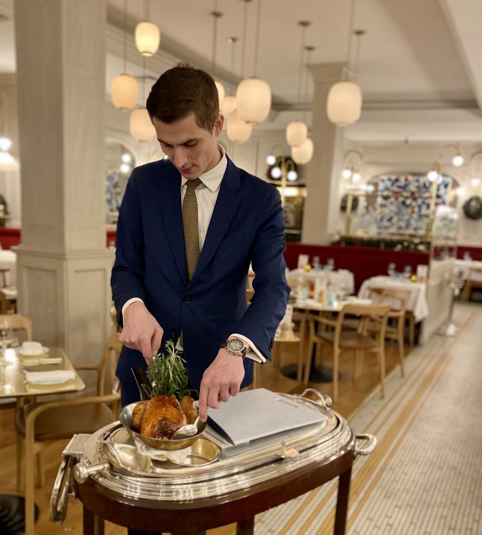 At Benoit, manager Olivier Gresselin carves the chicken table side.
