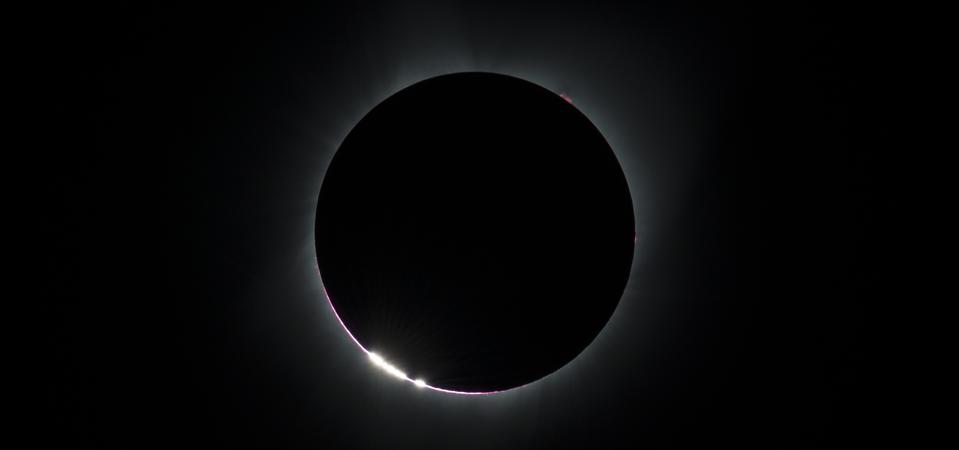 The Baily's Beads effect is seen as the moon makes its final move over the sun during the total solar eclipse on Monday, August 21, 2017 above Madras, Oregon. A total solar eclipse swept across a narrow portion of the contiguous United States from Lincoln Beach, Oregon to Charleston, South Carolina. A partial solar eclipse was visible across the entire North American continent along with parts of South America, Africa, and Europe.
