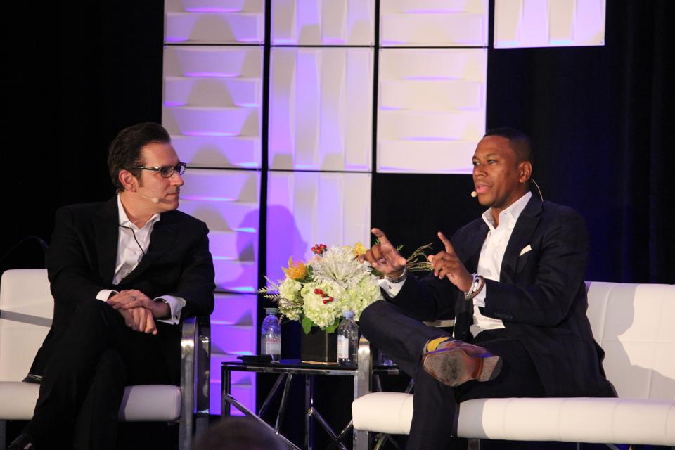 Glenn Llopis and Gyasi Chisley during their fireside chat at the Age of Personalization Executive Summit.