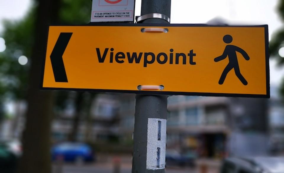 A sign that reads the word VIEWPOINT  and provides an image of a man & an arrow.