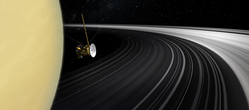 Artist's concept of Cassini orbiter crossing Saturn's ring plane.