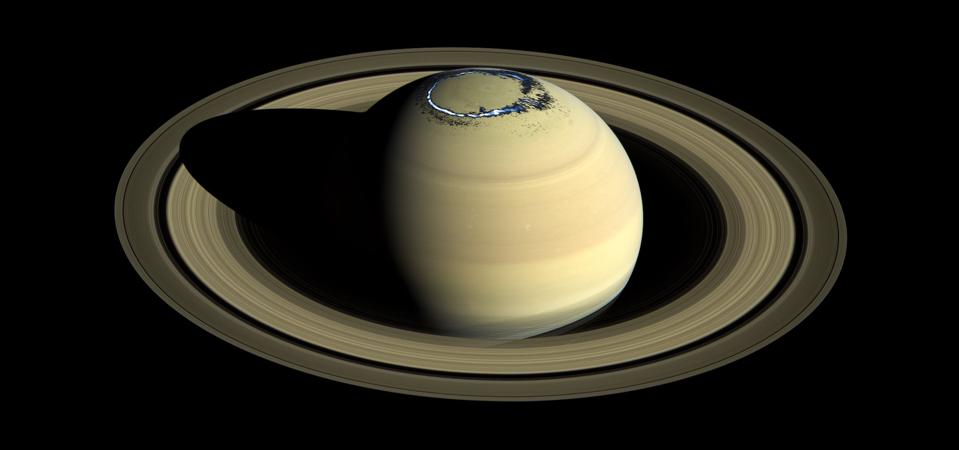 Composite of a true colour image of Saturn, observed by Cassini in 2016, overlaid with a false colour representation of the ultraviolet aurora in the northern hemisphere as observed on 20 August 2017.