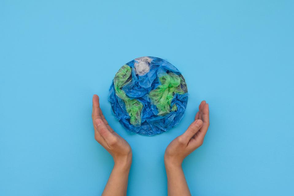 hands cupping a world