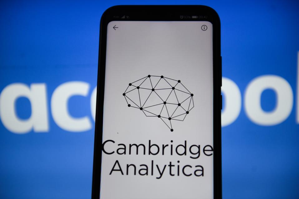 In this photo illustration a Cambridge Analytica logo seen...