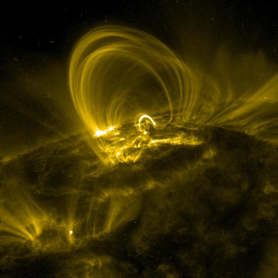 Solar coronal loops, observed by NASA's Transition Region And Coronal Explorer (TRACE).