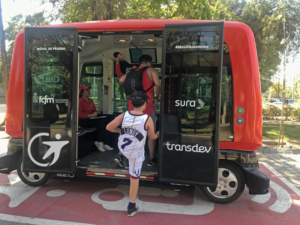 A commuter boards an EZ10 in the Transdev pilot project in Santiago de Chile.