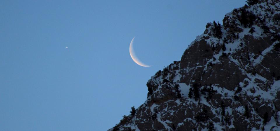 Venus and the waning crescent Moon rise above the Wasatch Mountains near Salt Lake City on Jan. 31, 2019.