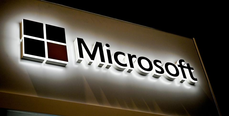 The Microsoft logo and company name shown on a banner in black and white