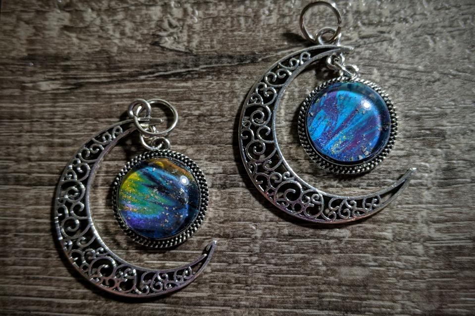 Two half-moon pendants made by Dee Ketelsen.