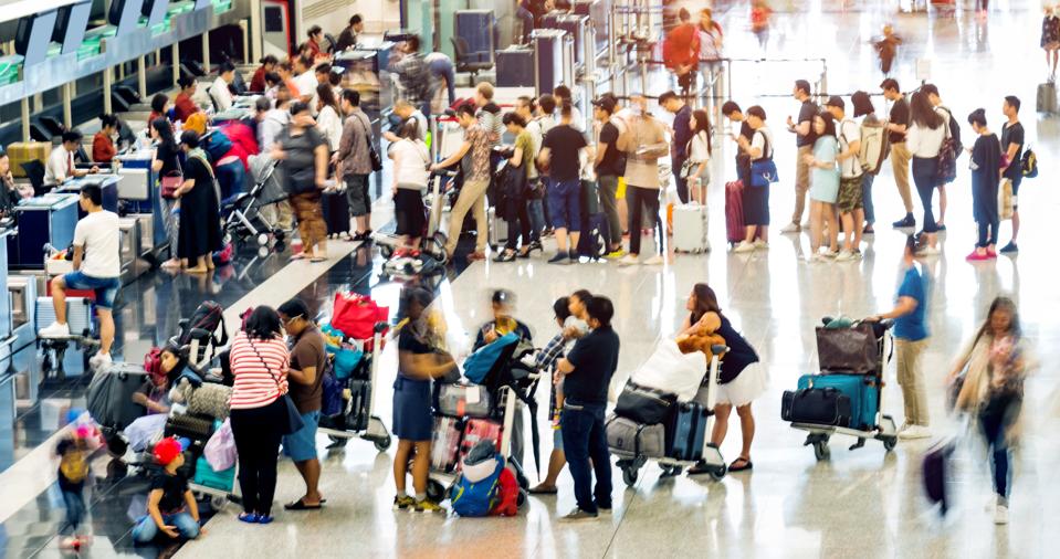 Crowd of people waiting for check-in