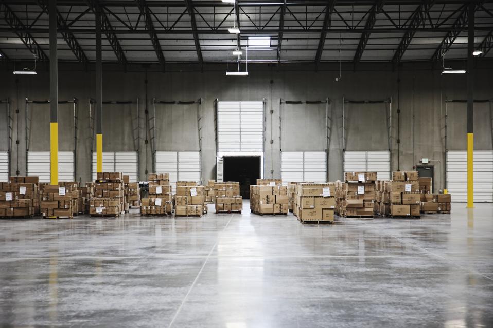 Cardboard boxes at loading dock in warehouse