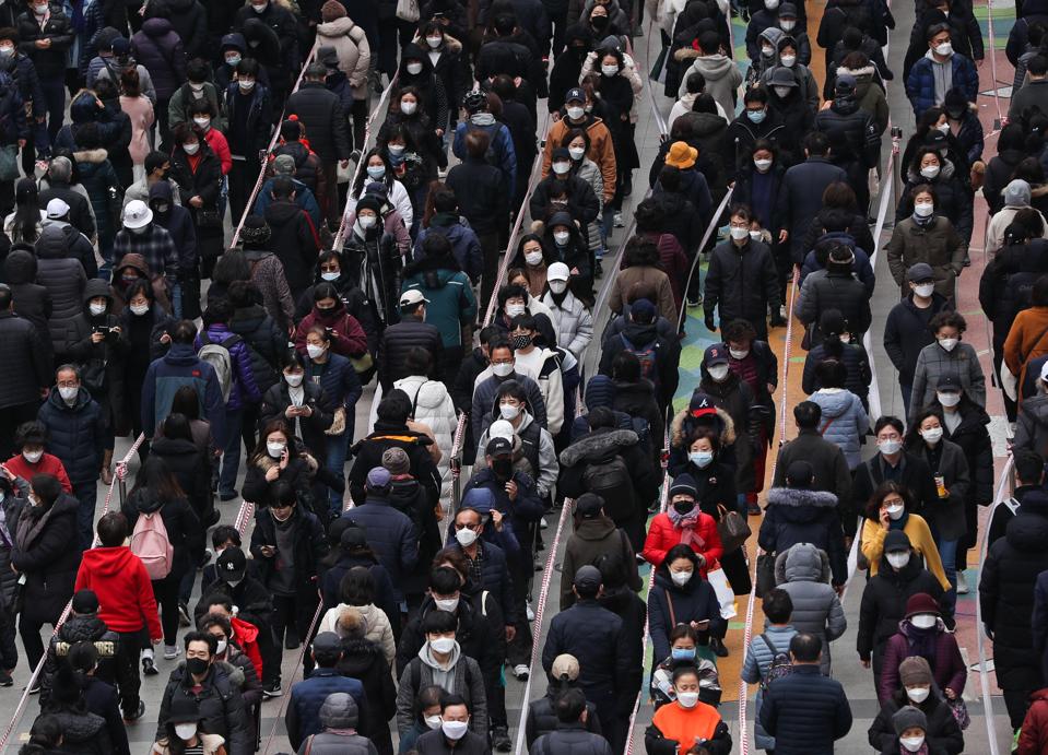 People line up to buy face masks.