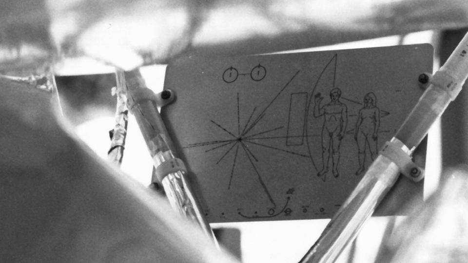 Black and white photo of etched plaque on Pioneer spacecraft