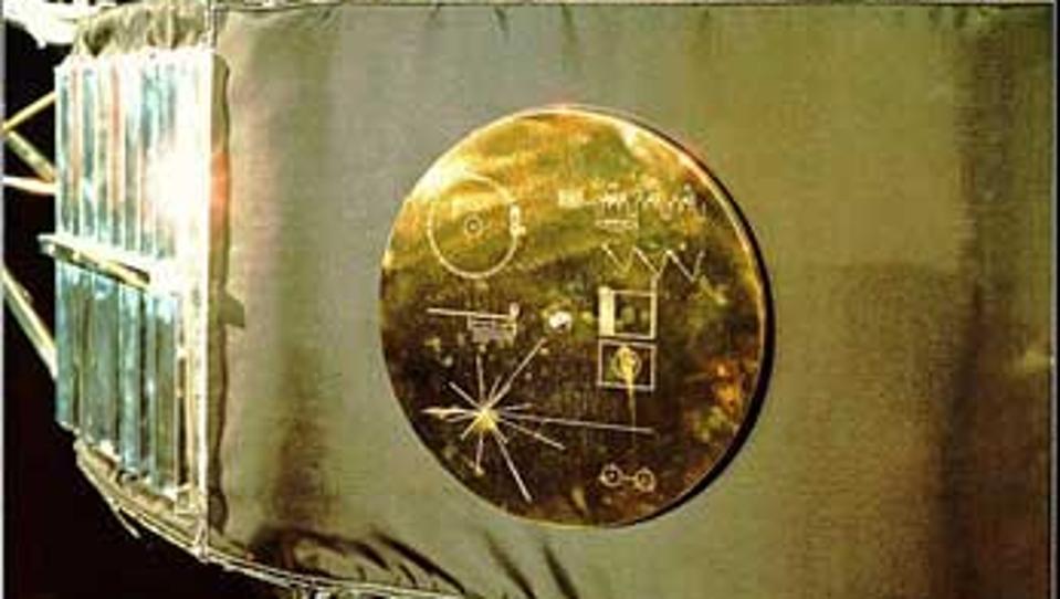 Color photo of golden record cover attached to Voyager spacecraft.