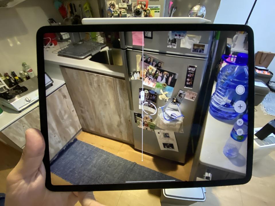The iPad Pro 2020 using the Measure app to measure the length of my refrigerator.