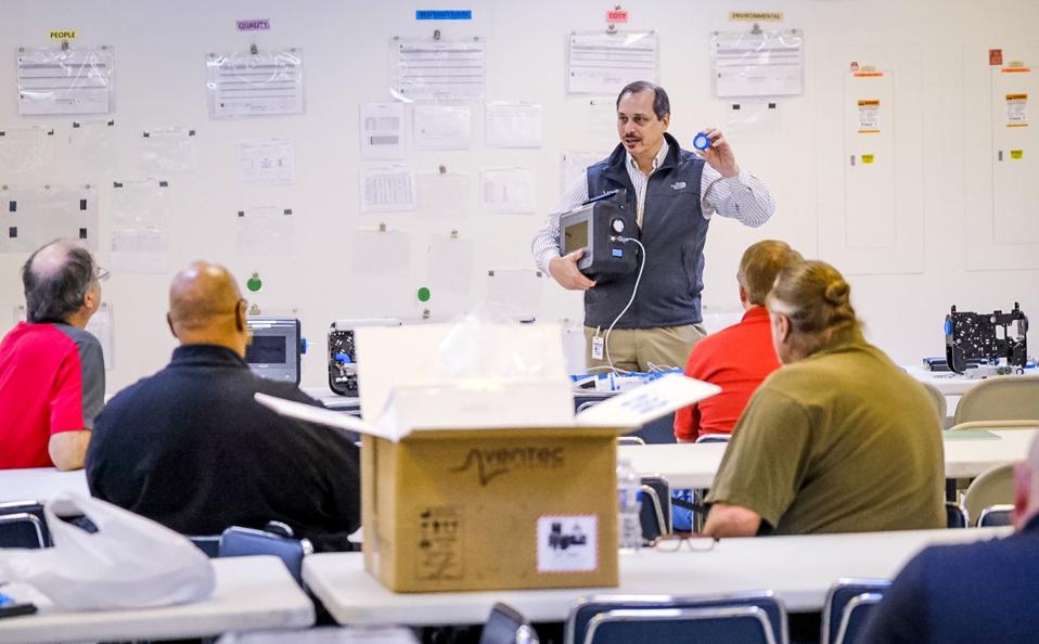 Ventec Life Systems Vice President Engineering Joe Cipollone explains its VOCSN critical care ventilator Friday March 27, 2020, to General Motors employees who will be helping to produce the ventilators at the GM Kokomo, Indiana manufacturing facility, in response to the COVID-19 pandemic. The FDA-cleared ventilators are scheduled to ship as soon as next month. (Photo by AJ Mast for General Motors)