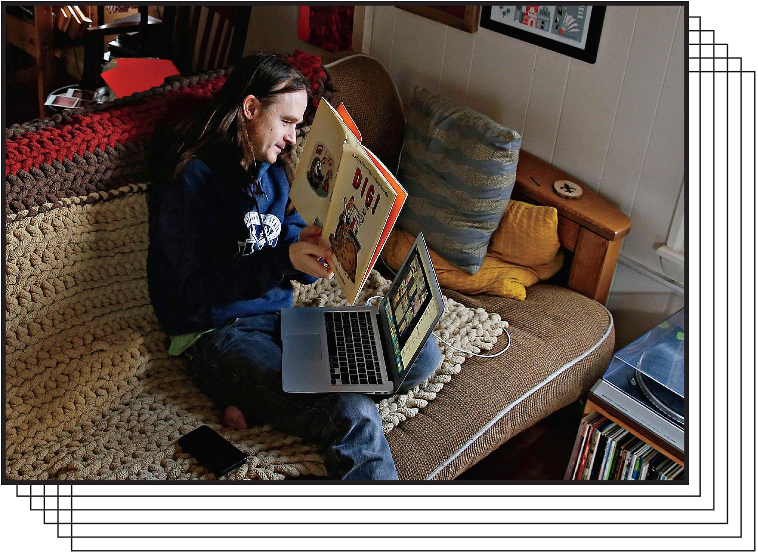 Kindergarten teacher James Baldwin reads a children’s book to his students using Zoom.