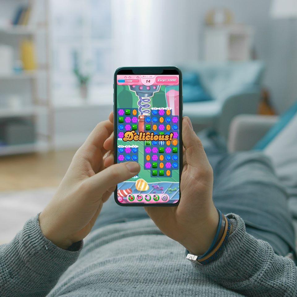 A user playing a King mobile game.