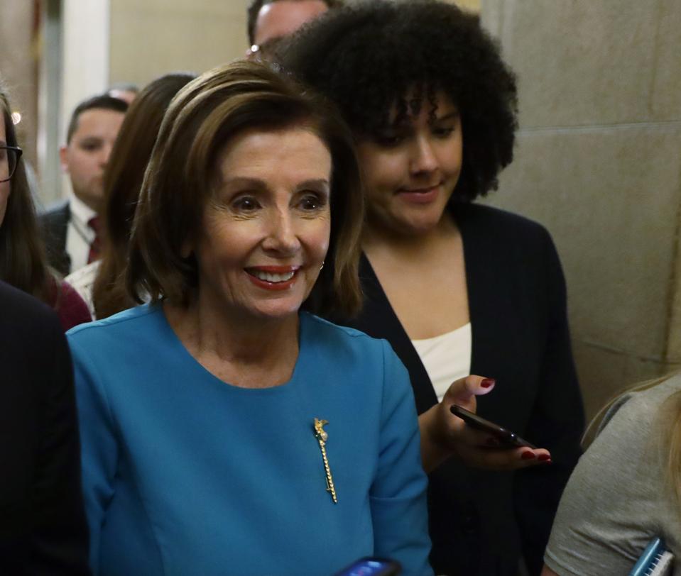 WASHINGTON, DC - MARCH 13: U.S. Speaker of the House Rep. Nancy Pelosi (D-CA) is followed by members of the media on her way back to her office after a briefing on the Coronavirus Aid Package Bill (Photo by Alex Wong/Getty Images)