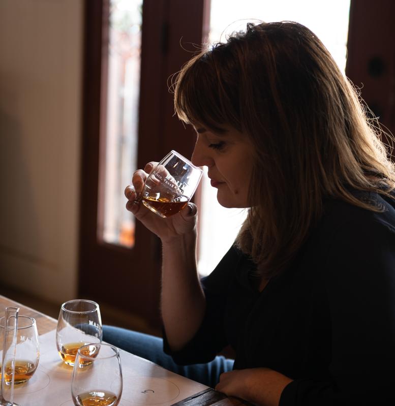 Heather Greene smelling a glass of Bourbon whiskey