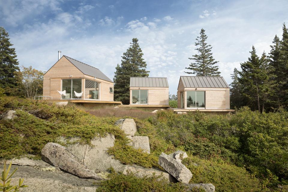 These Little Houses on a Ferry in Vinalhaven, ME were designed by GoLogic, engineered by Bensonwood with panels provided by Chantiers Chibougamau, a factory in Quebec.