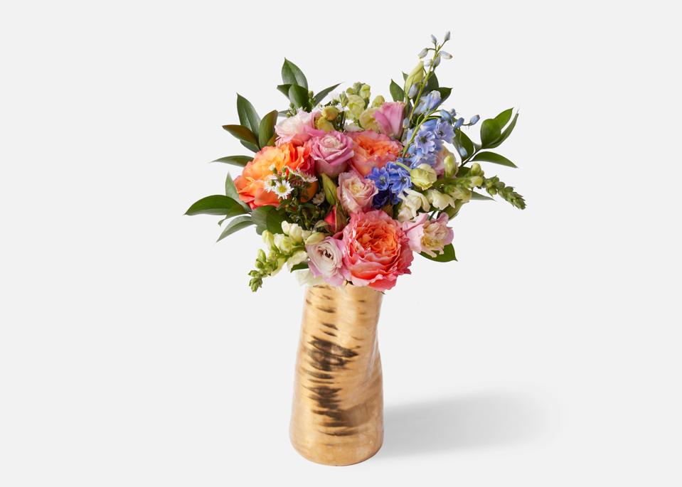 flowers in gold vase