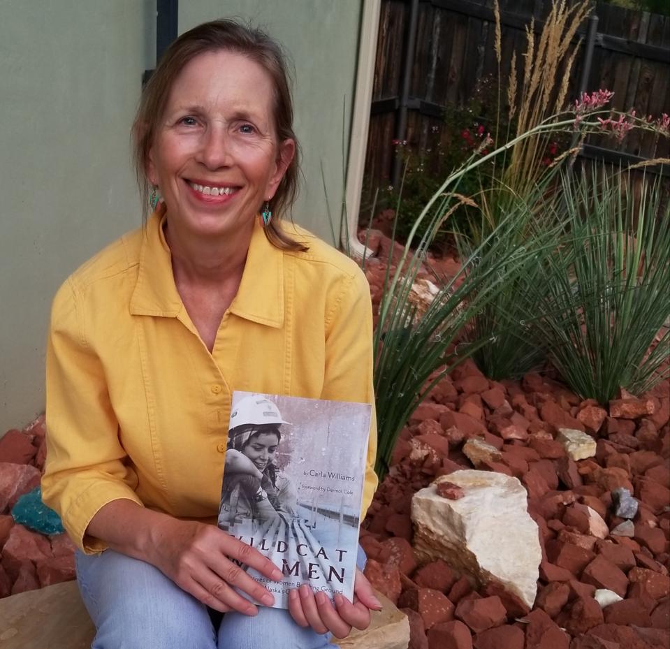 Author Carla Williams with her book.