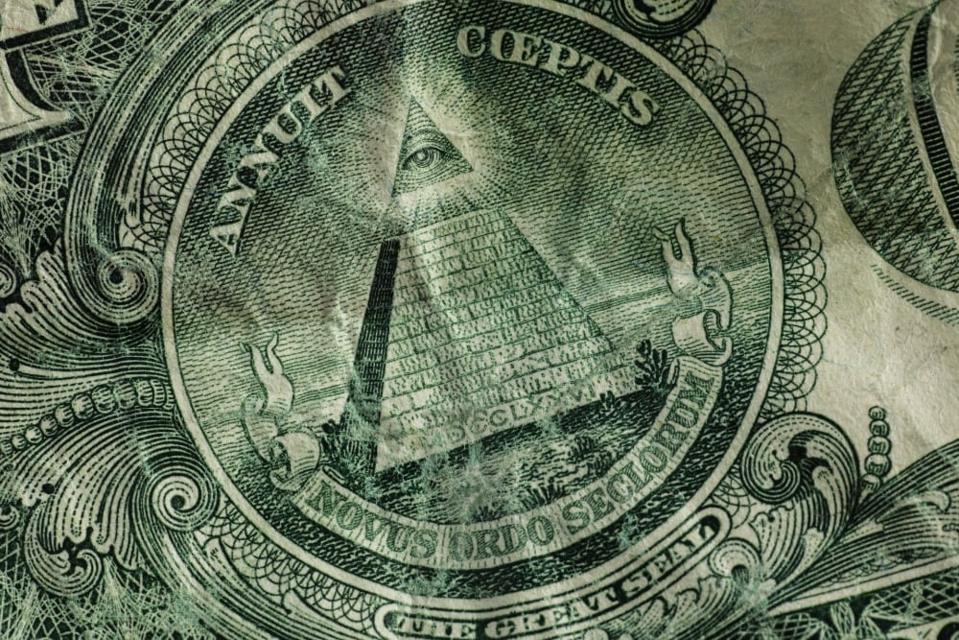 Close-up of currency with a pyramid and an eye ...