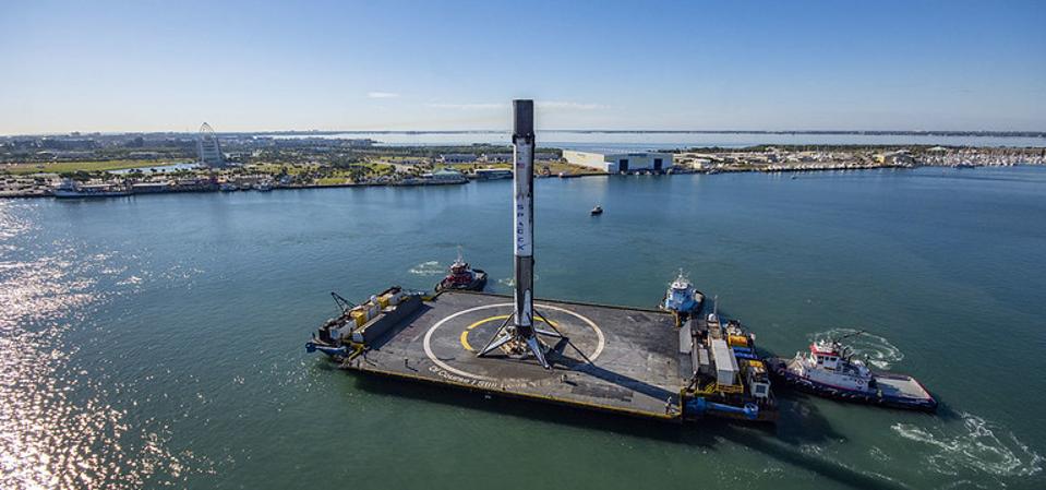 Falcon 9's first stage booster will land on a SpaceX barge in the Atlantic Ocean.