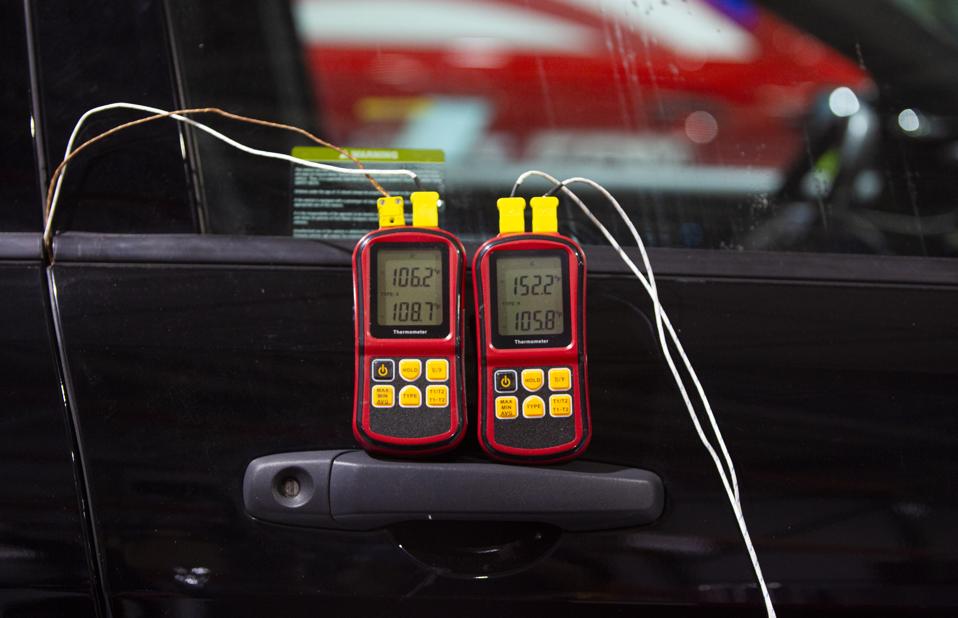 Ford engineers testing a coronavirus heat soak system on a Police Interceptor Utility