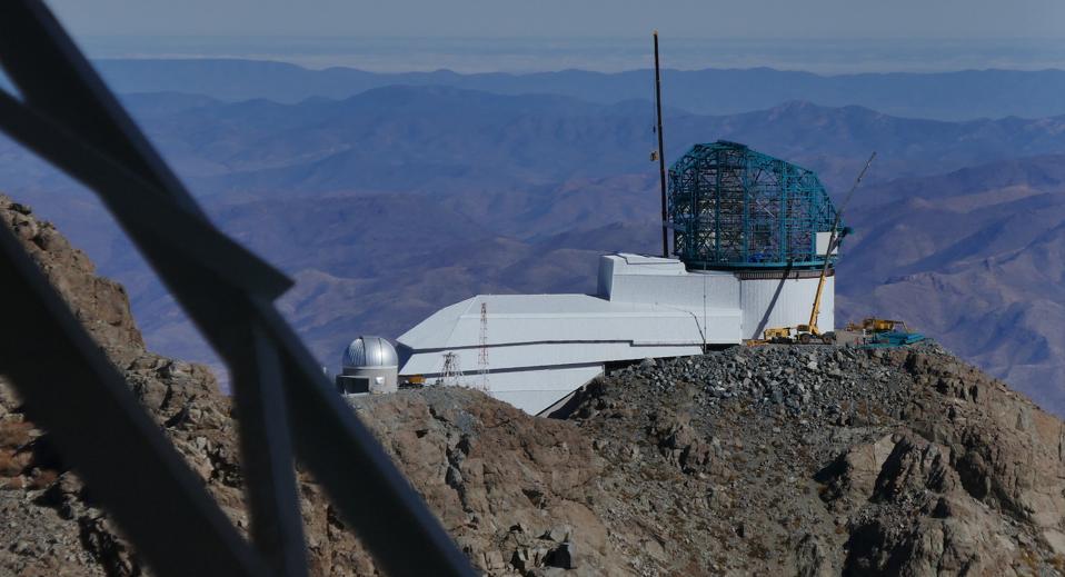 The Rubin Observatory under construction, as seen from inside the Gemini South Telescope dome, in July 2019.