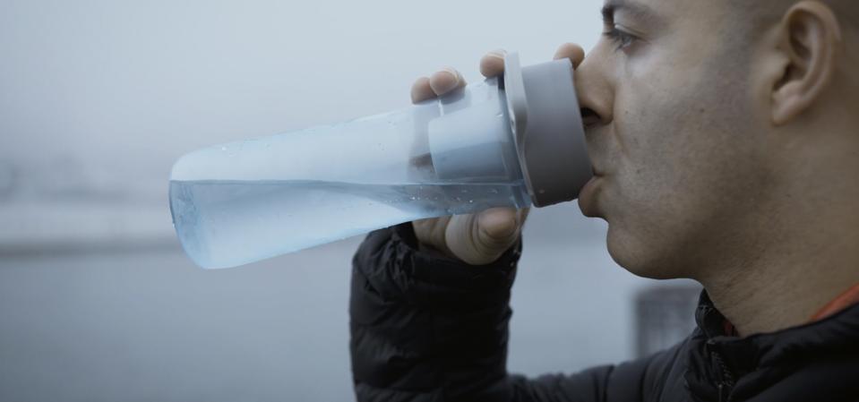 Winston Ibrahim drinks from a Hydros water bottle