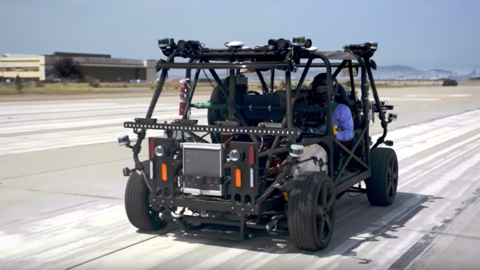 A prototype Zoox vehicle that is covered in sensors and omni-directional