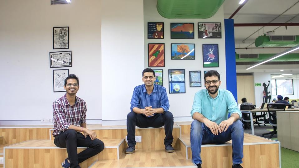 three co-founders of Indian education ap Gradeup seated on the floor