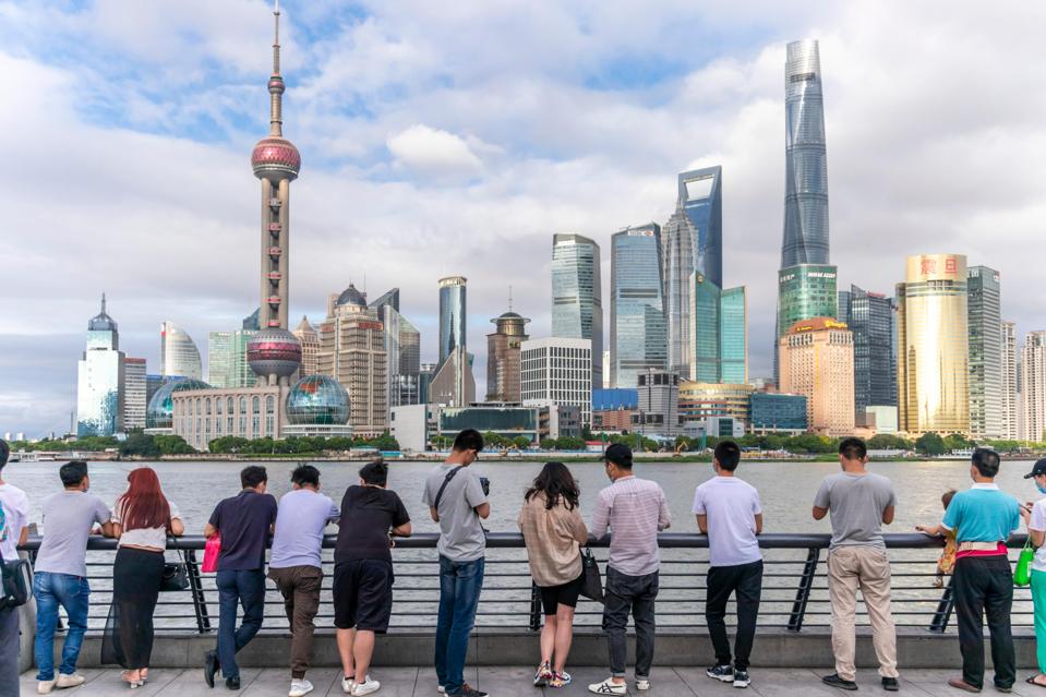 Tourists admire Shanghai's skyline.