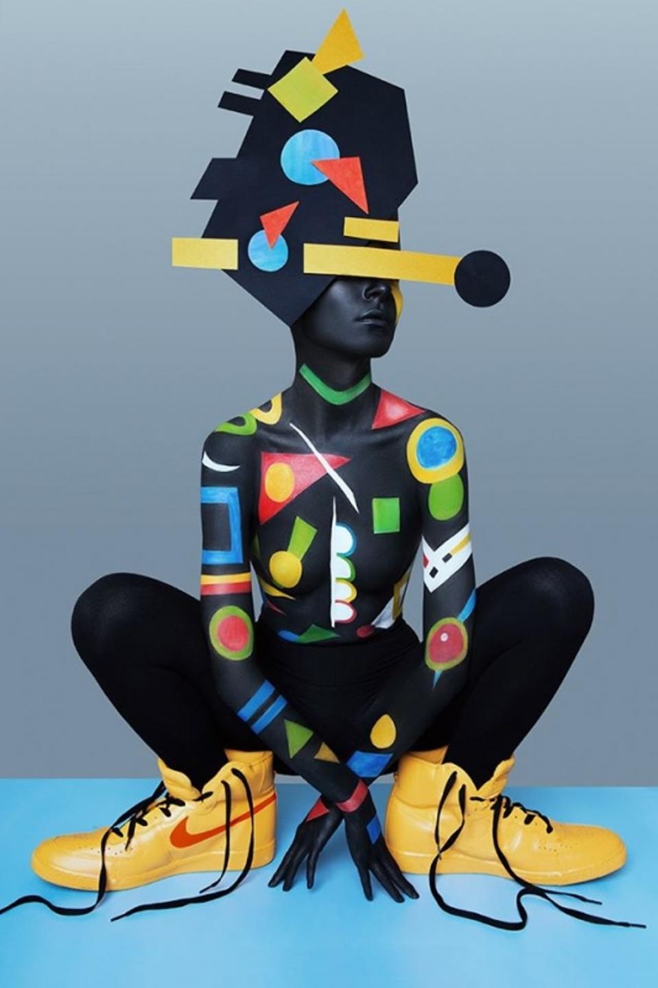 Geometric lines and big yellow shoes on model