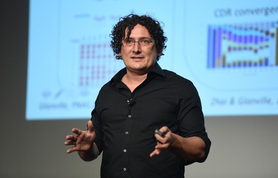 A scientist addresses a group about universal vaccines at the SynBioBeta conference.