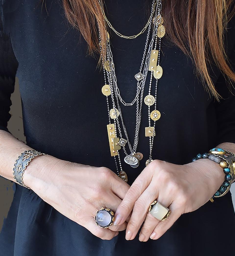 Designer Stella Flame is decked out in her Story Chain necklaces.