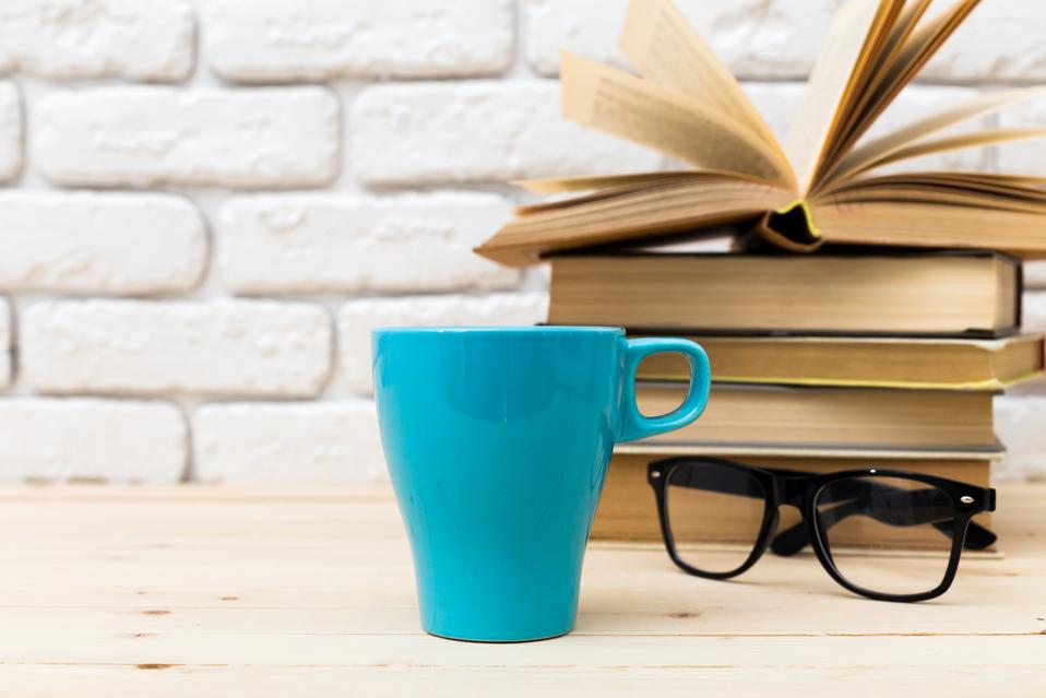 Blue Coffee Cup on Table with Glasses and Books | Top 20 Books To Read This Summer