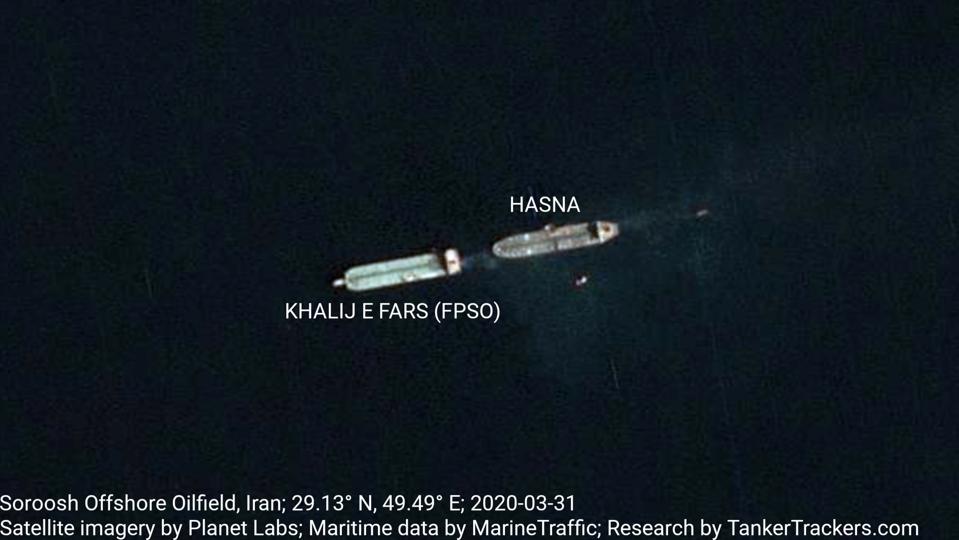 A tanker and an FPSO in the water. The tanker is loading crude oil.