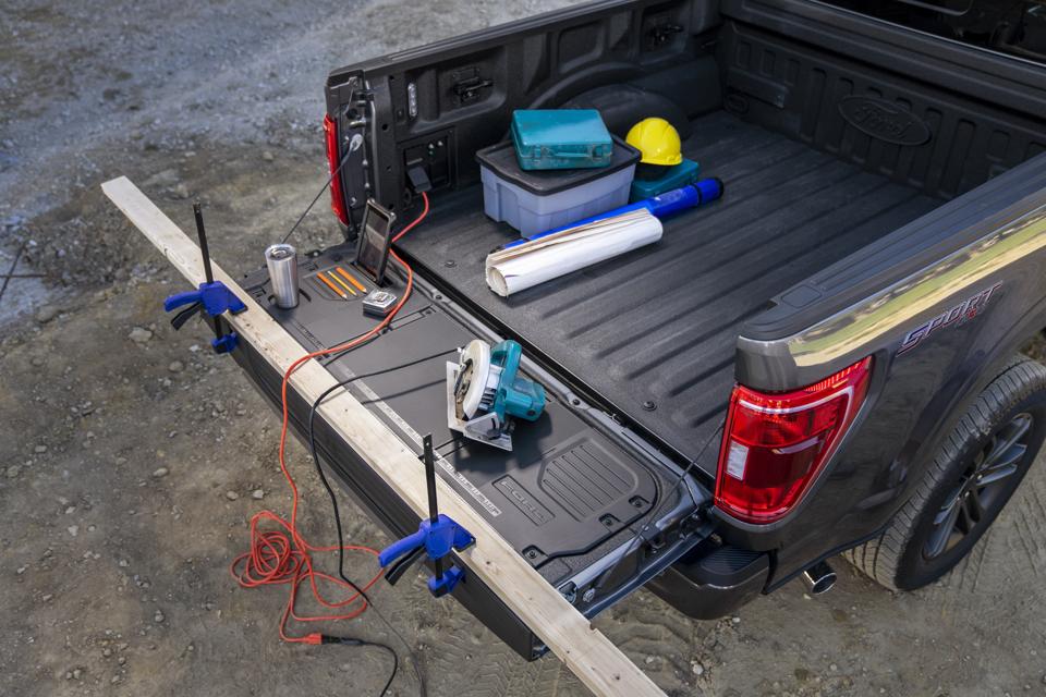 2021 Ford F-150 work surface tailgate has slots for tablets, pencils and drinks, a built-in ruler, slots for clamps and cleats for tie-downs on the ends