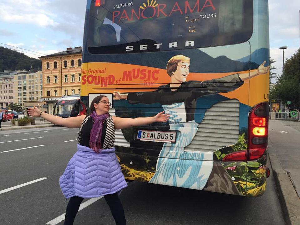 The author imitating Julie Andrews outside The Sound of Music tour bus.