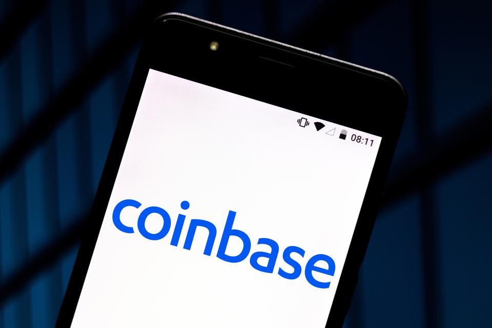 In this photo illustration the Coinbase logo is seen...