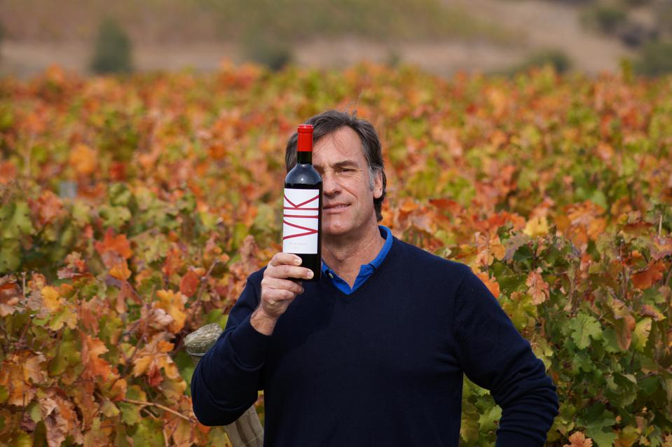 Winemaker Cristian Vallejo with a bottle of VIK.