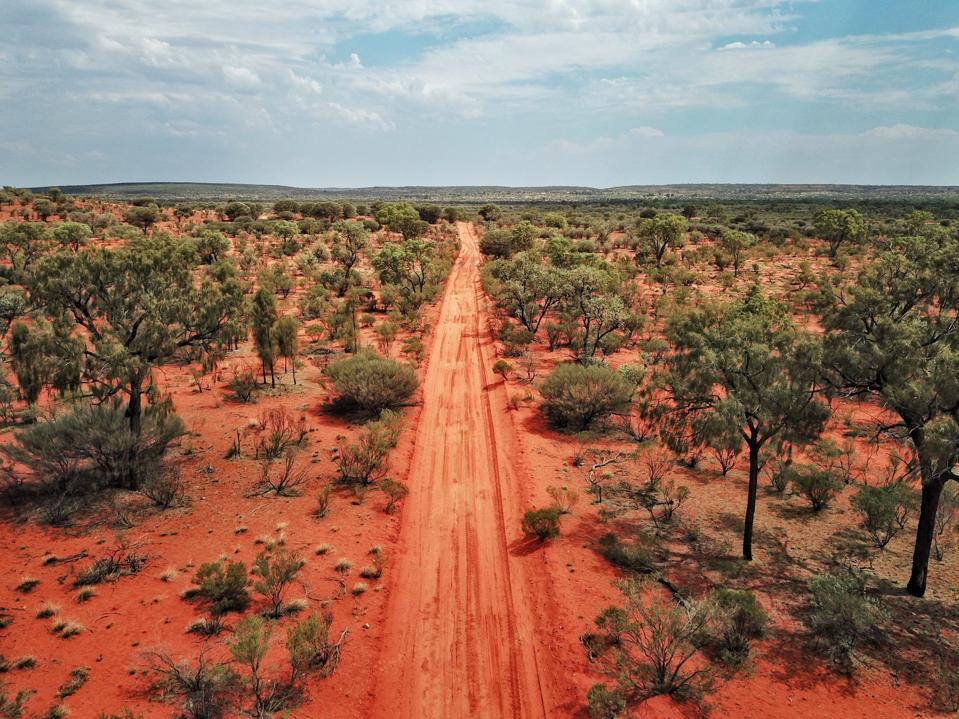 An Aerial shot of the red centre roads in the Australian Outback