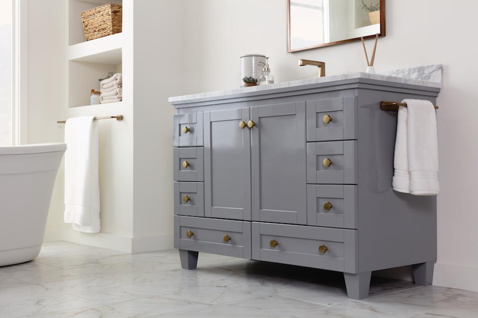 How Changing One Thing Can Change Everything In Kitchens And Bathrooms 6 gold knobs on a gray vanity