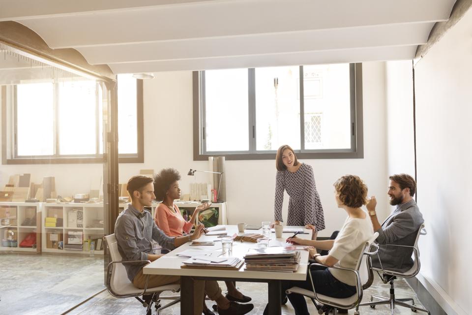 Business people discussing in board room