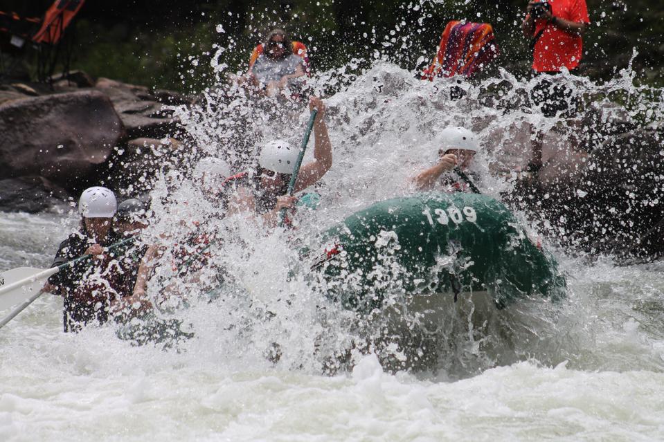 Team rafting on a whitewater river