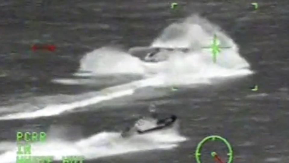 A Coast Guard Long Range Interceptor boat (LRI) chases down a fleeing go-fast boat