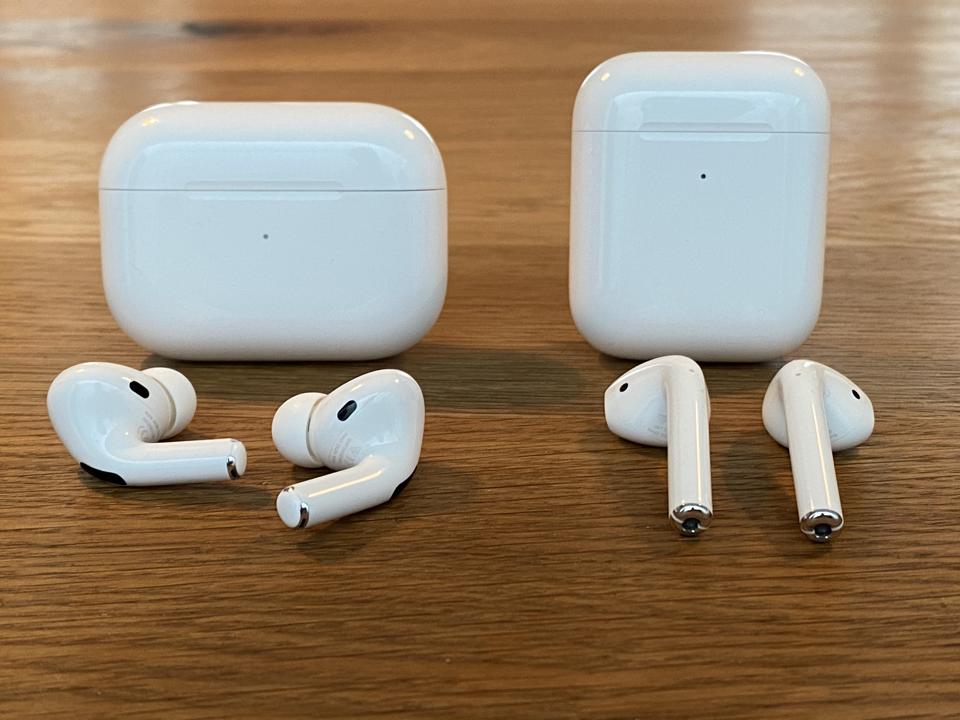 AirPods Pro, left, and AirPods. Will AirPods 3 look more like the Pros?